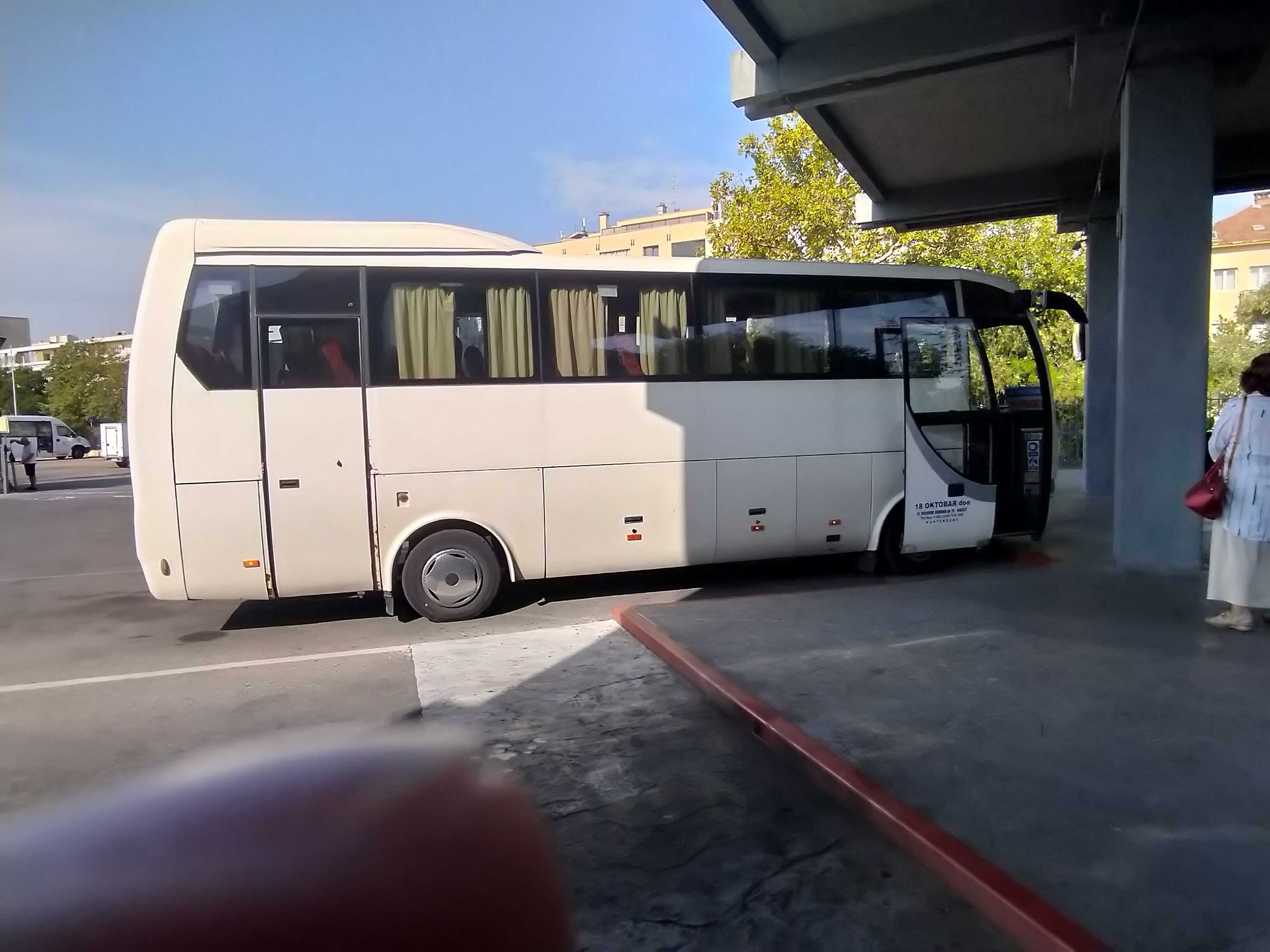 Bus 18. Oktobar doo waiting for passengers in Podgorica, Montenegro